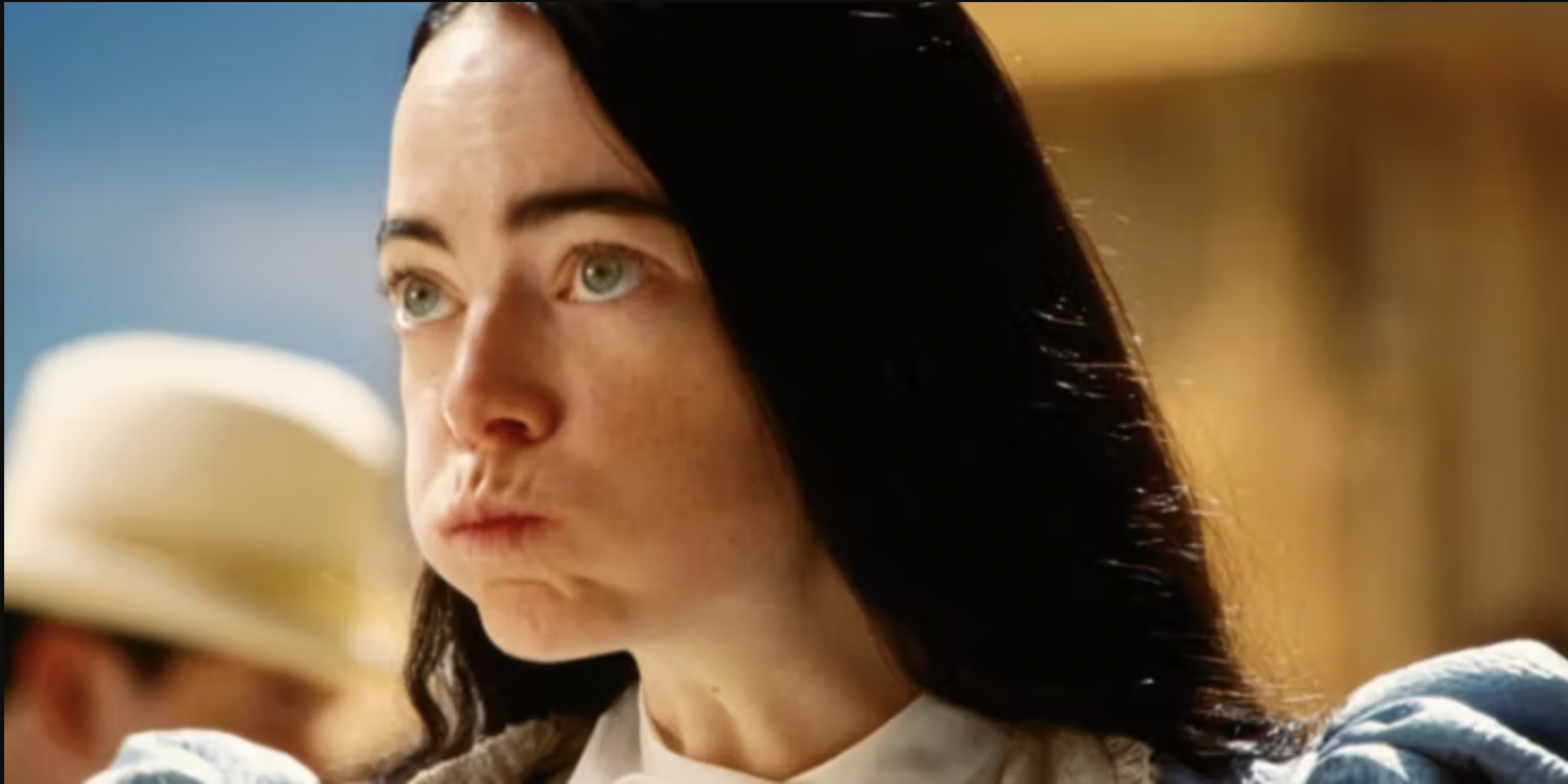 Emma Stone has eaten too many cookies and is puffing her cheeks out like a chipmunk and/or toddler.