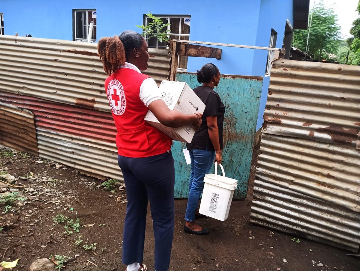 Photo showing flooding impacts and community response efforts in St. Vincent