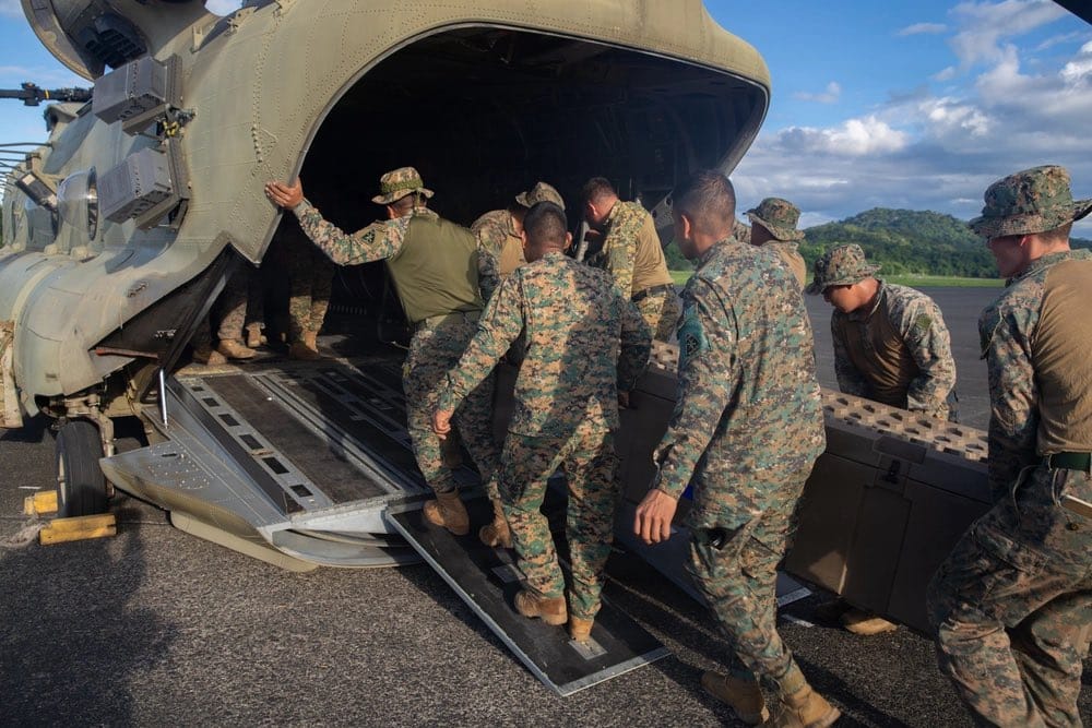 Personnel loading aid supplies for earthquake relief in Panama