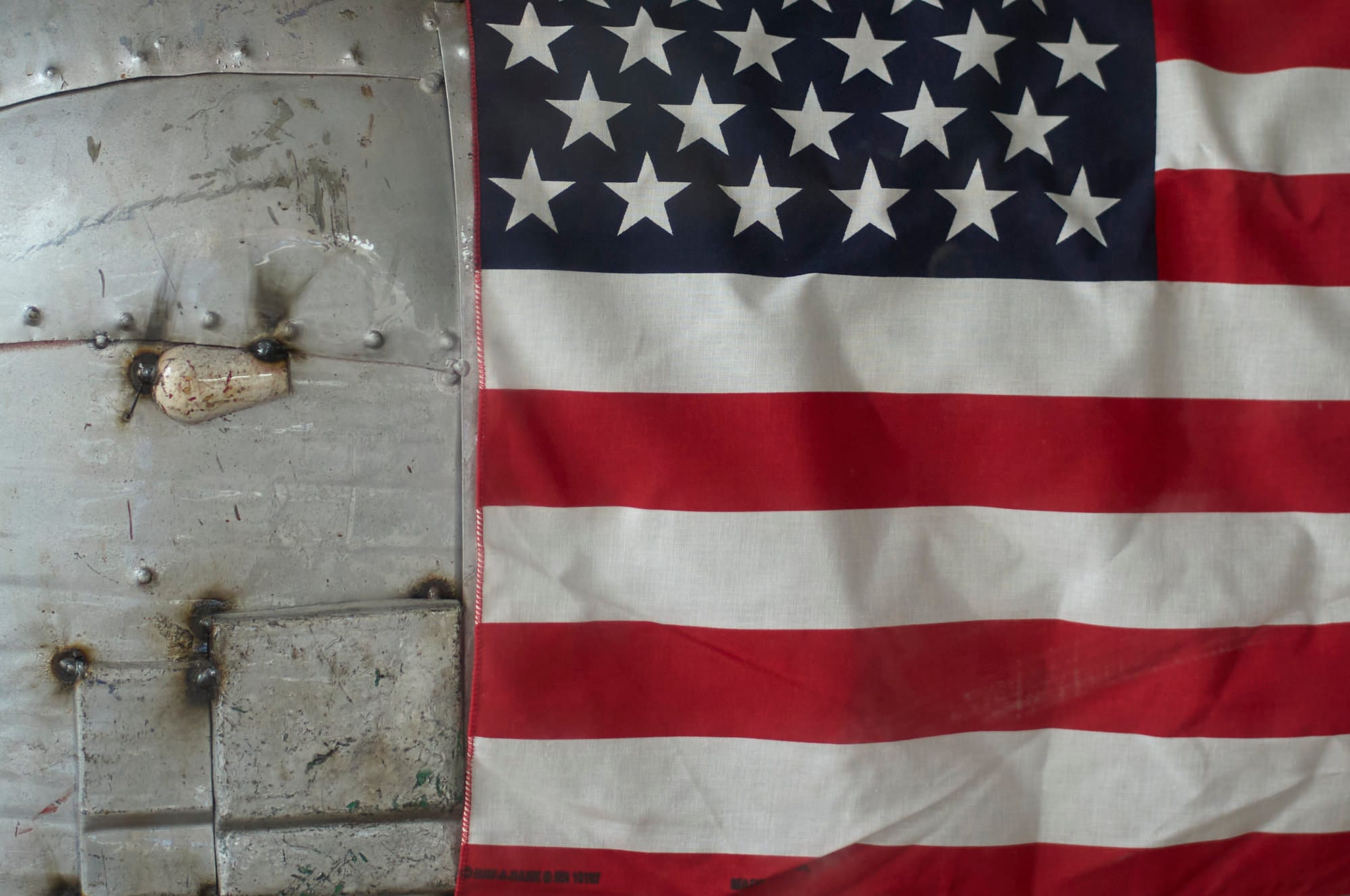 Close up of the airstream and american flag showing the linen threads sharp on the flag.