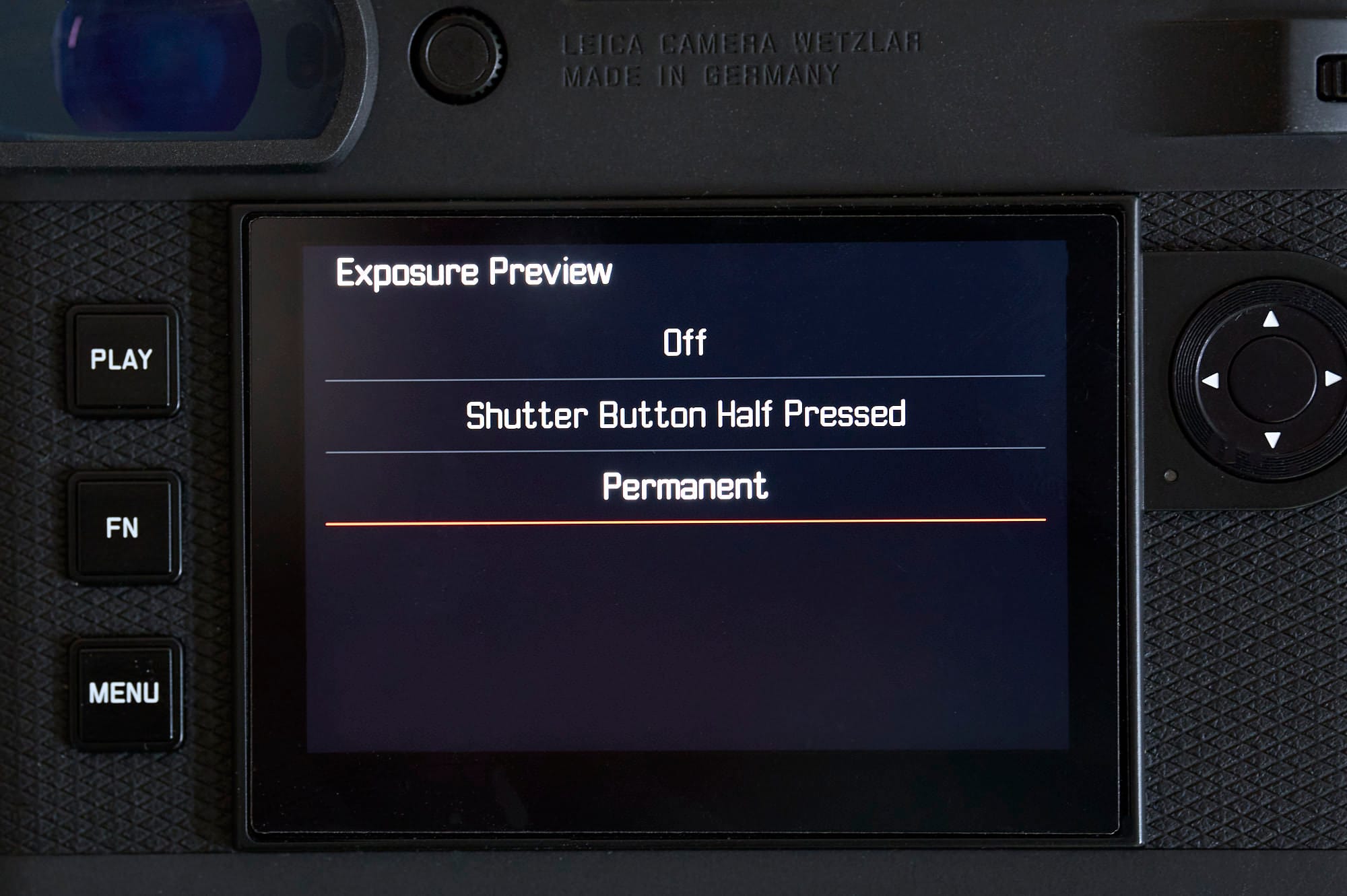 A black camer with a menu on the LCD in white letters on a black background.