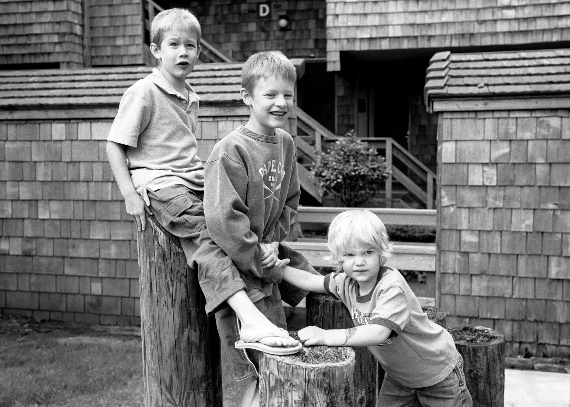 Black and white image of three boys.