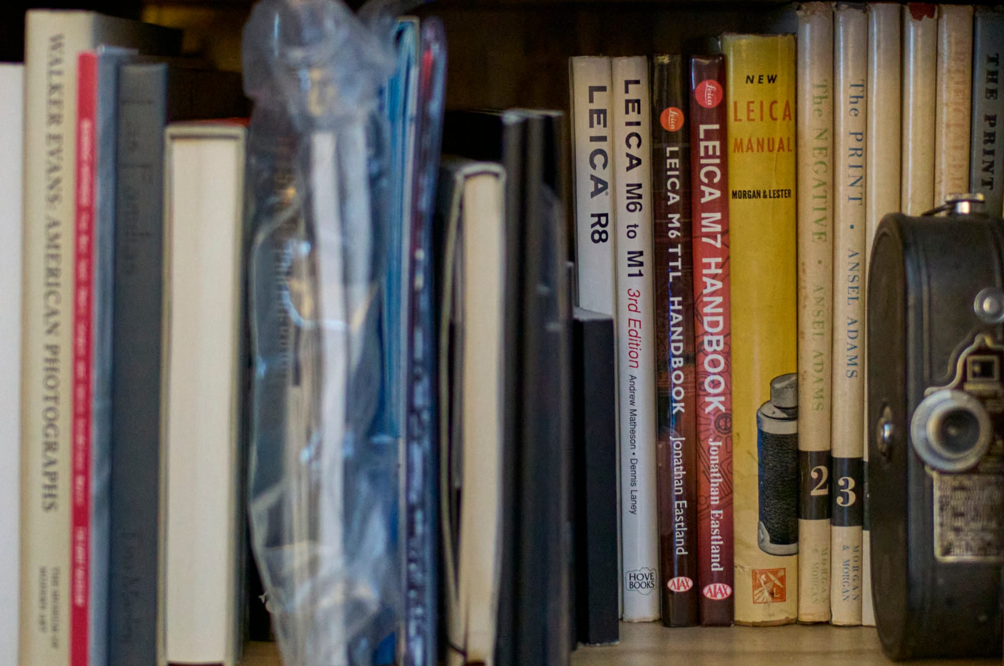 A shelf of manuals for older film Leicas.