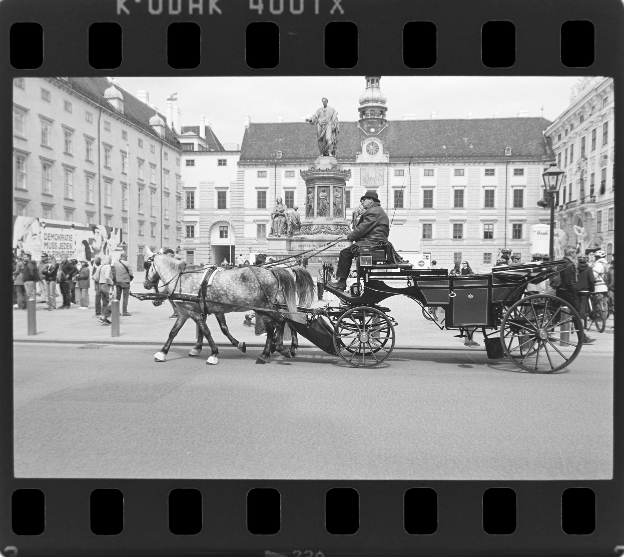 Horse and carriage with filmstrip borders.