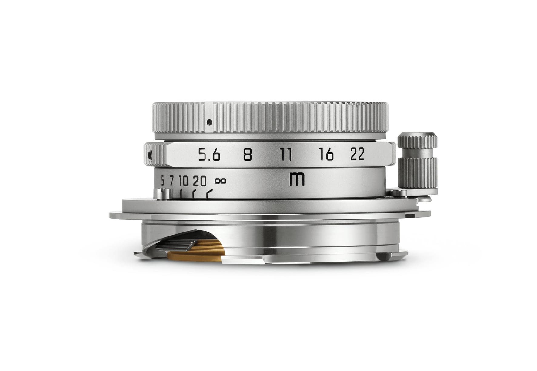 a silver 28mm Leica lens on a white background
