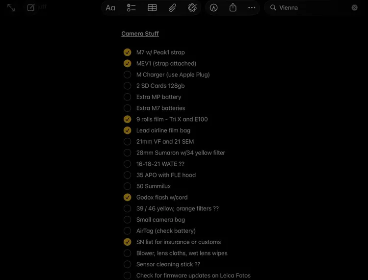 A list of camera equipment with some items checked off.
