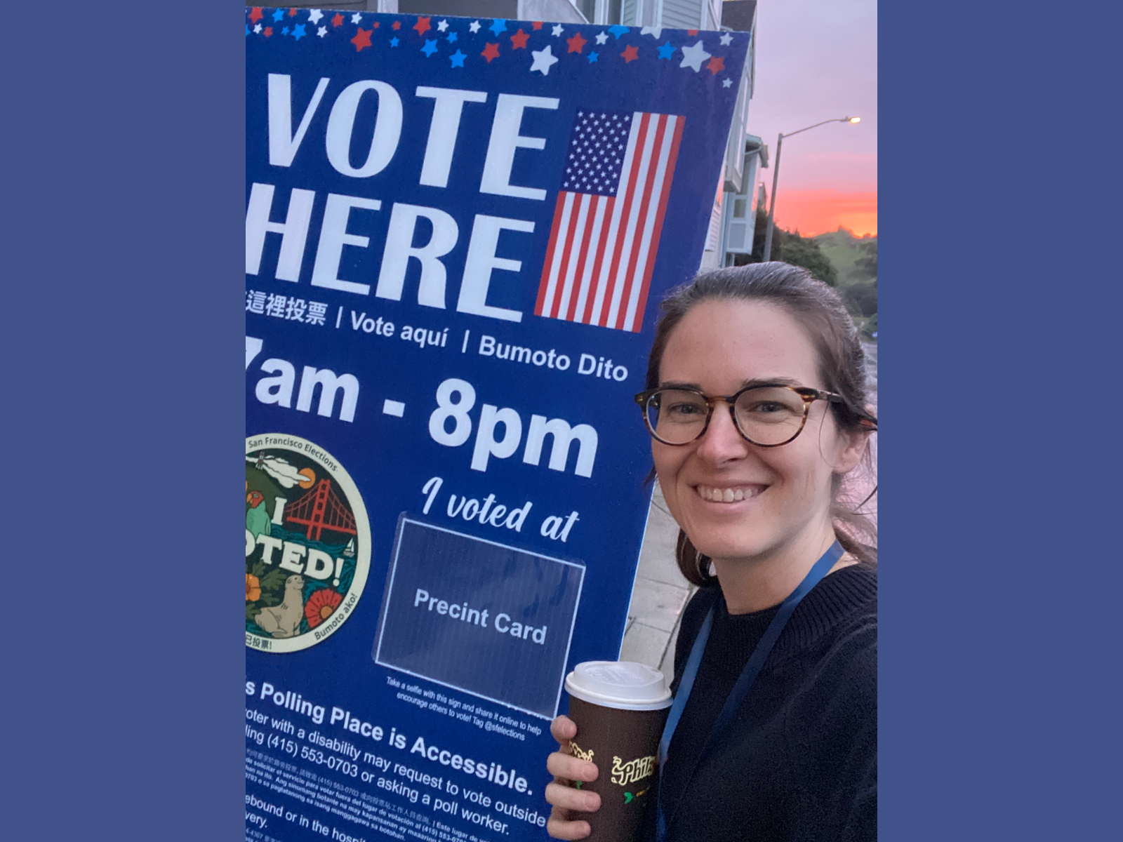 picture of poll worker in front of a Vote Here sign on Super Tuesday