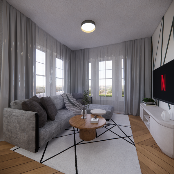 Cozy modern living room with a grey sectional, round wood coffee table, geometric rug, and sheer curtains framing large windows.