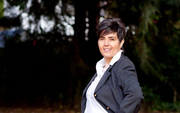 Confident Female Real Estate Investor in Canada Balancing Business, Purpose, and Freedom in a Male-Dominated Industry.