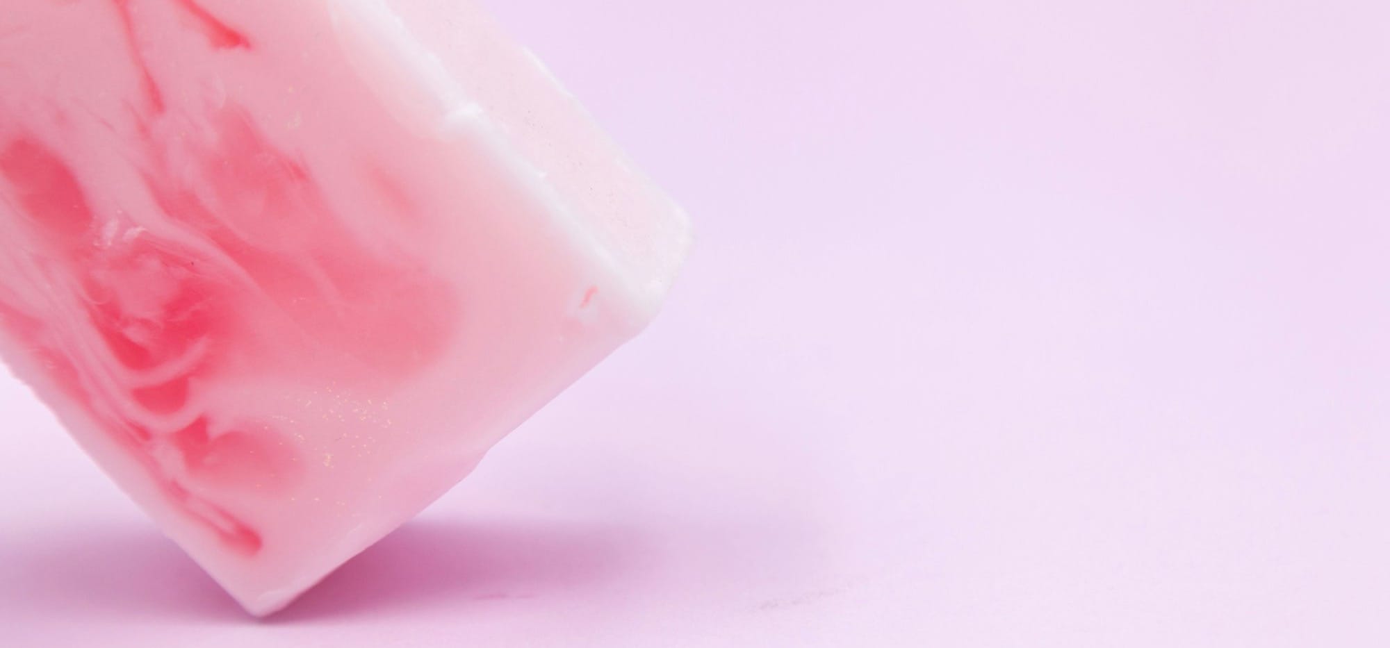 pink plastic container on white surface
