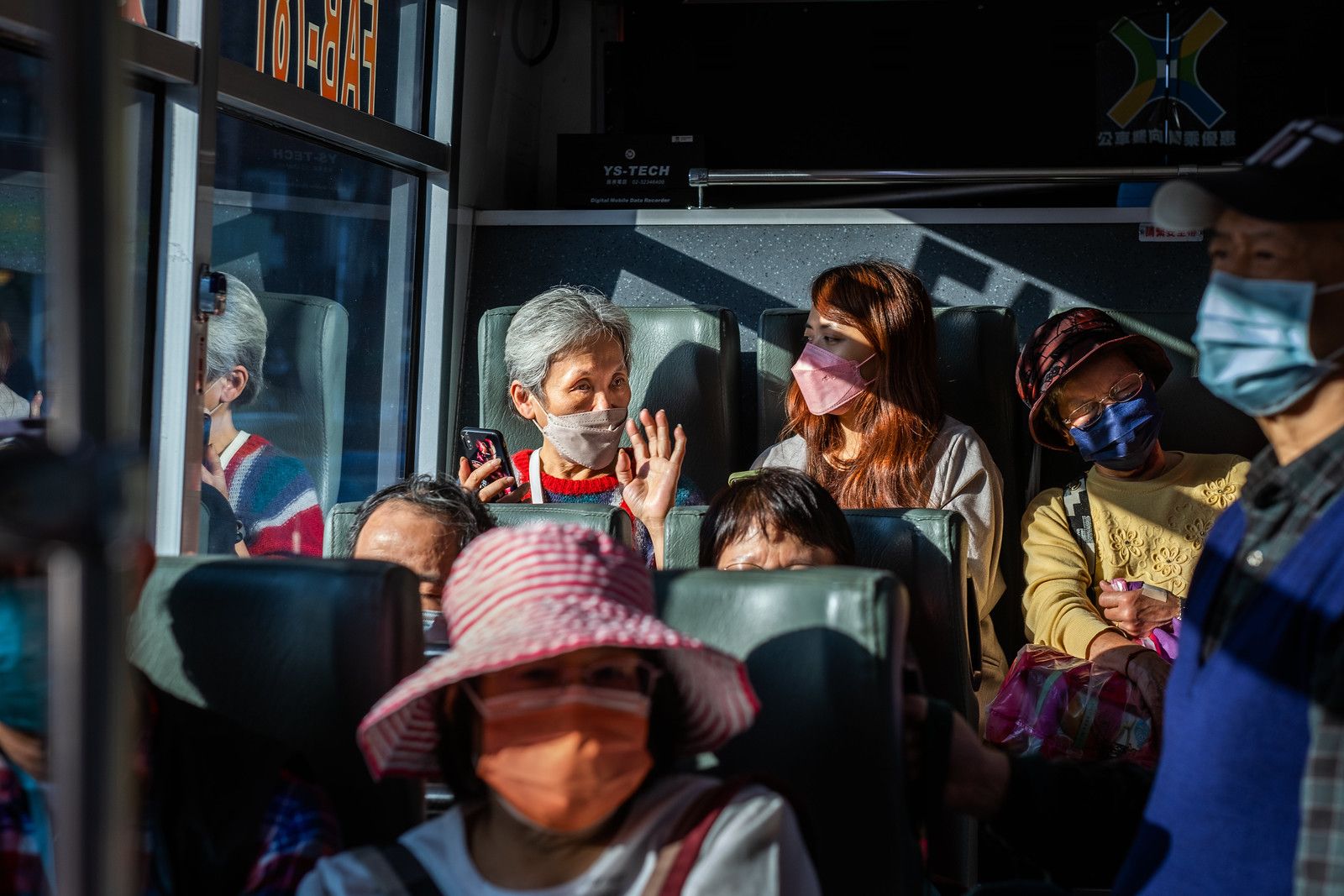 Passengers on a Bus in Taipei, Taiwan, by TC Lin (2023)
