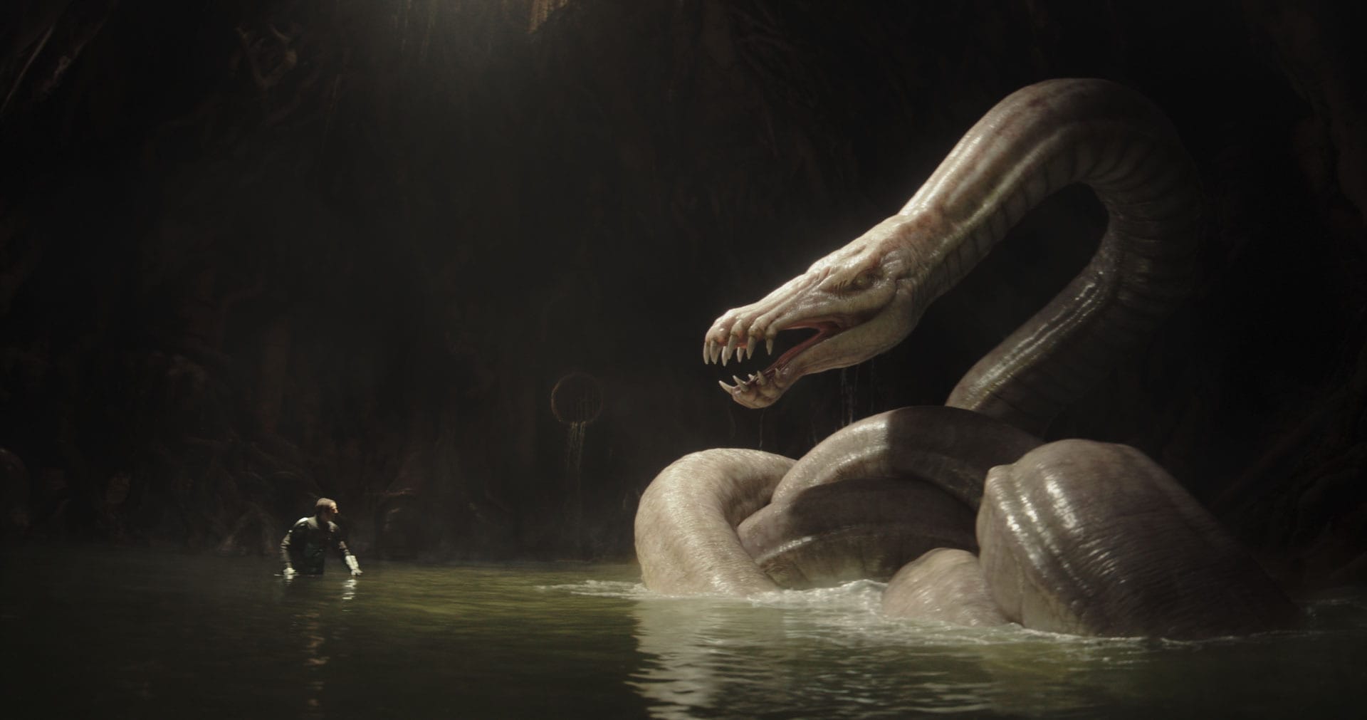 The Mandalorian (Pedro Pascal) squares off against a Dragonsnake in Star Wars: The Mandalorian and Grogu.