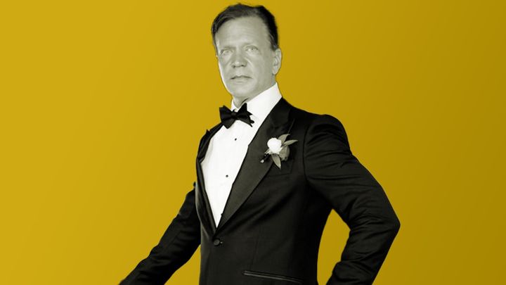 Paul Tozour stands in a tuxedo looking at the camera.