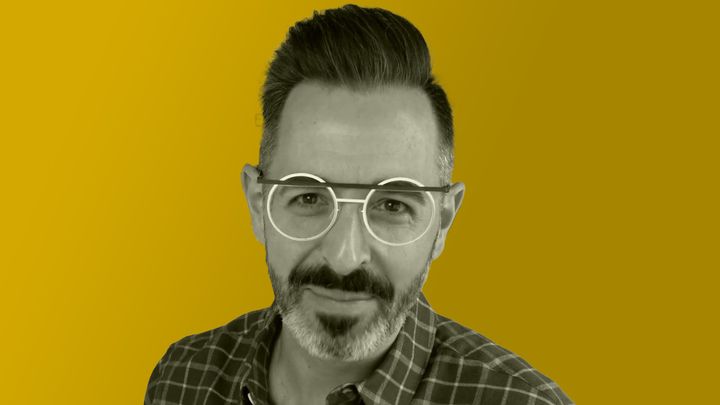 Rand Fishkin looks into the camera wearing art deco glasses.