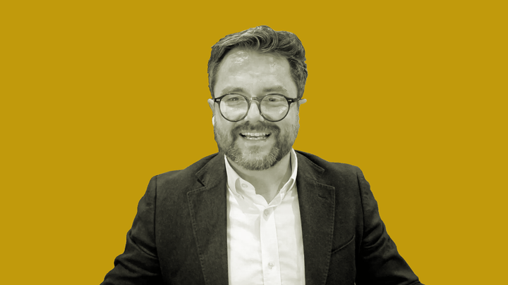 Dr Clinton White smiles while explaining ADHD's evolutionary advantage on the grokludo podcast.