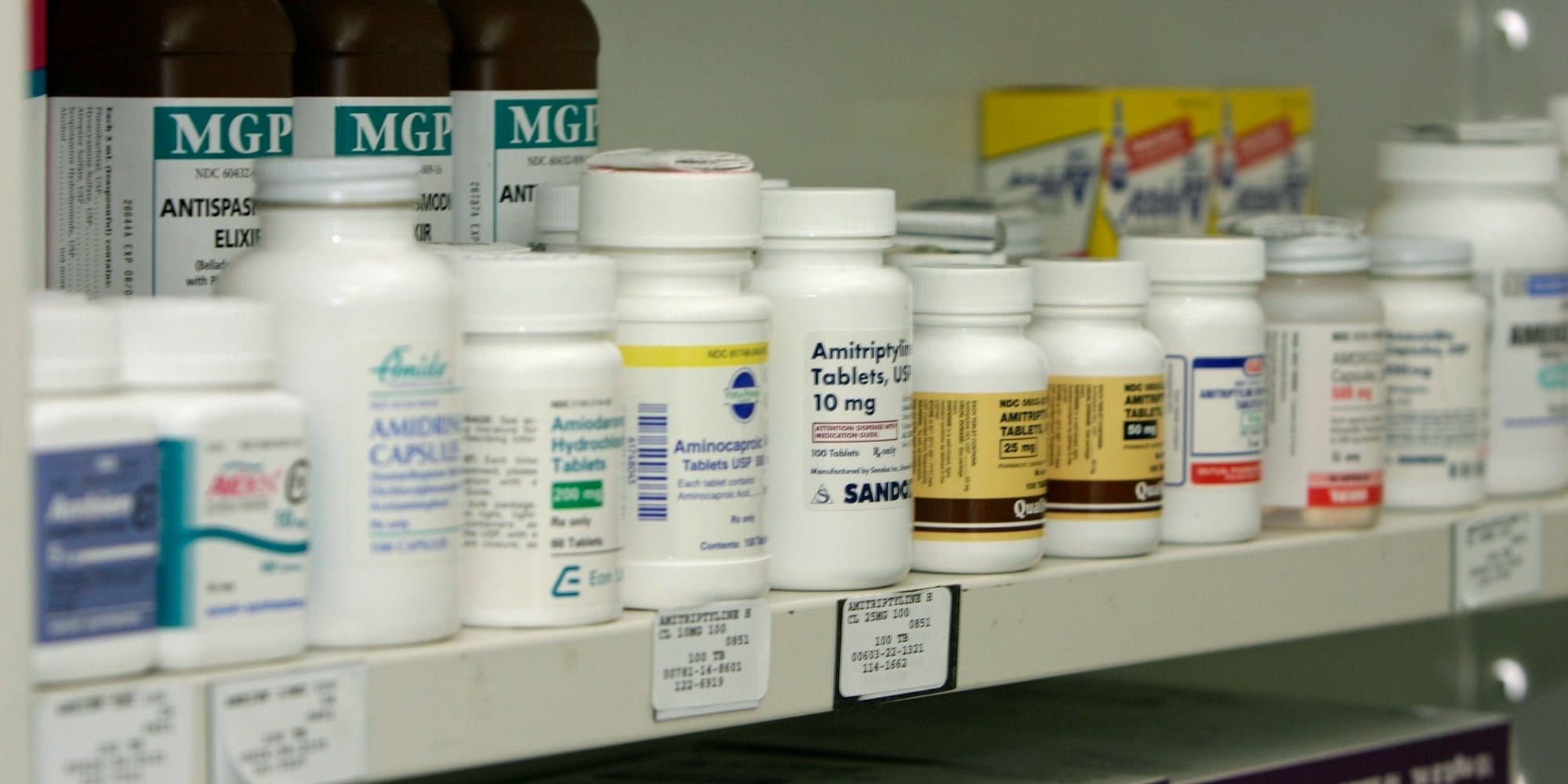 A shelf of medications; packages that look alike but are not interchangeable.
