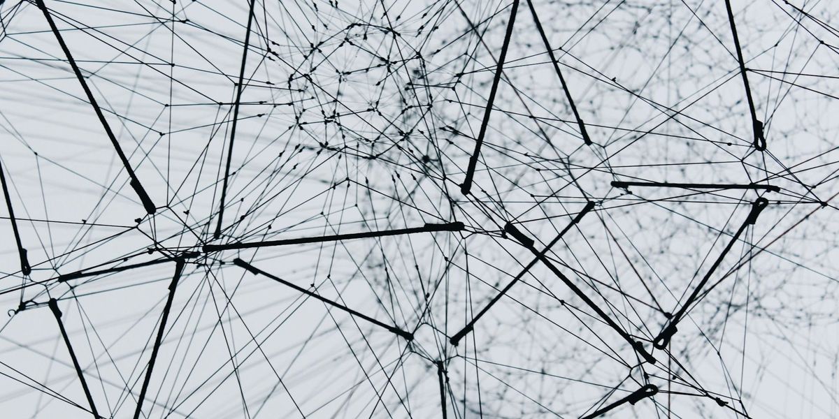 A dense, abstract lattice of interconnected nodes and links, suggesting a structured network of linked clinical concepts. 