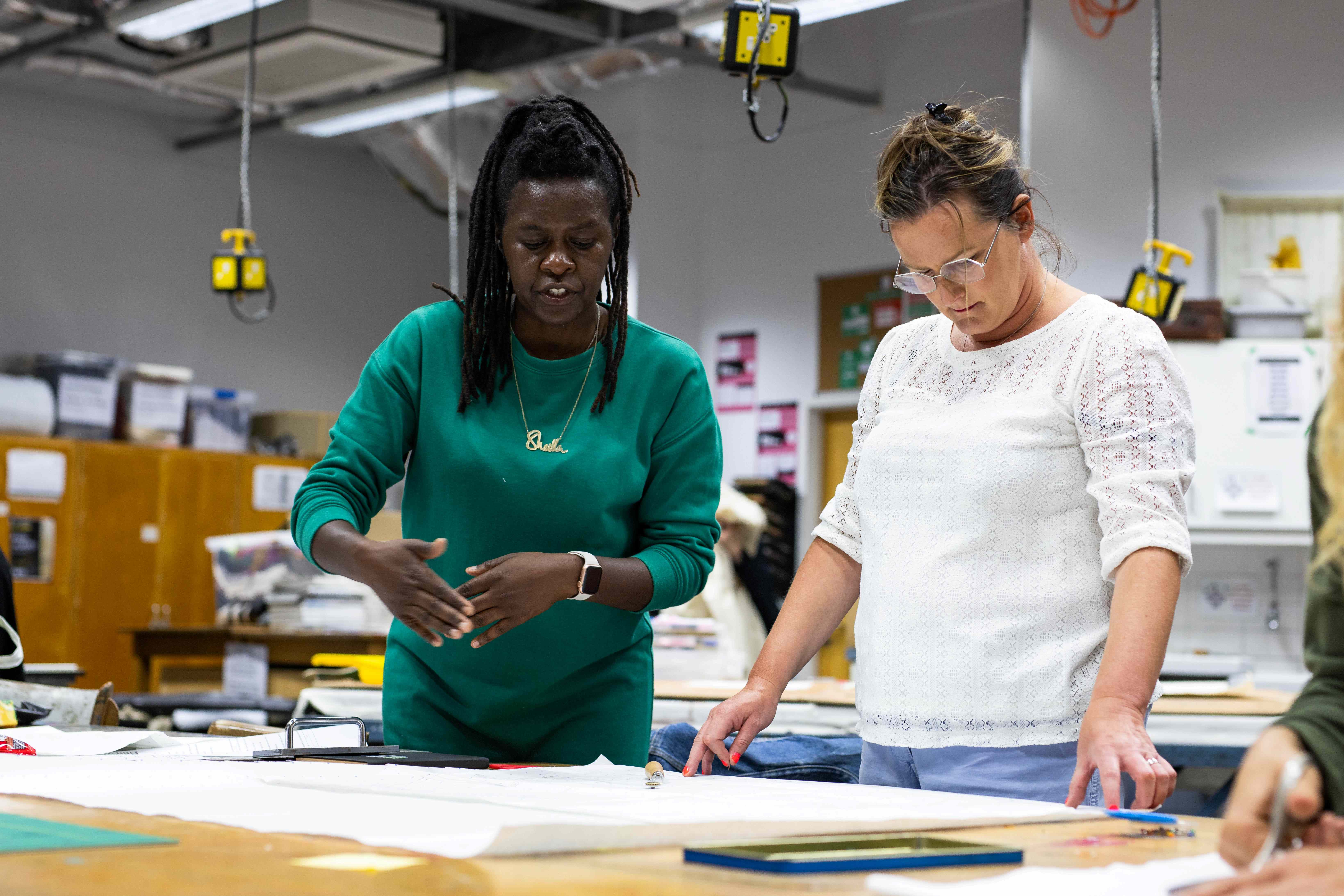 Two women on a printmaking course