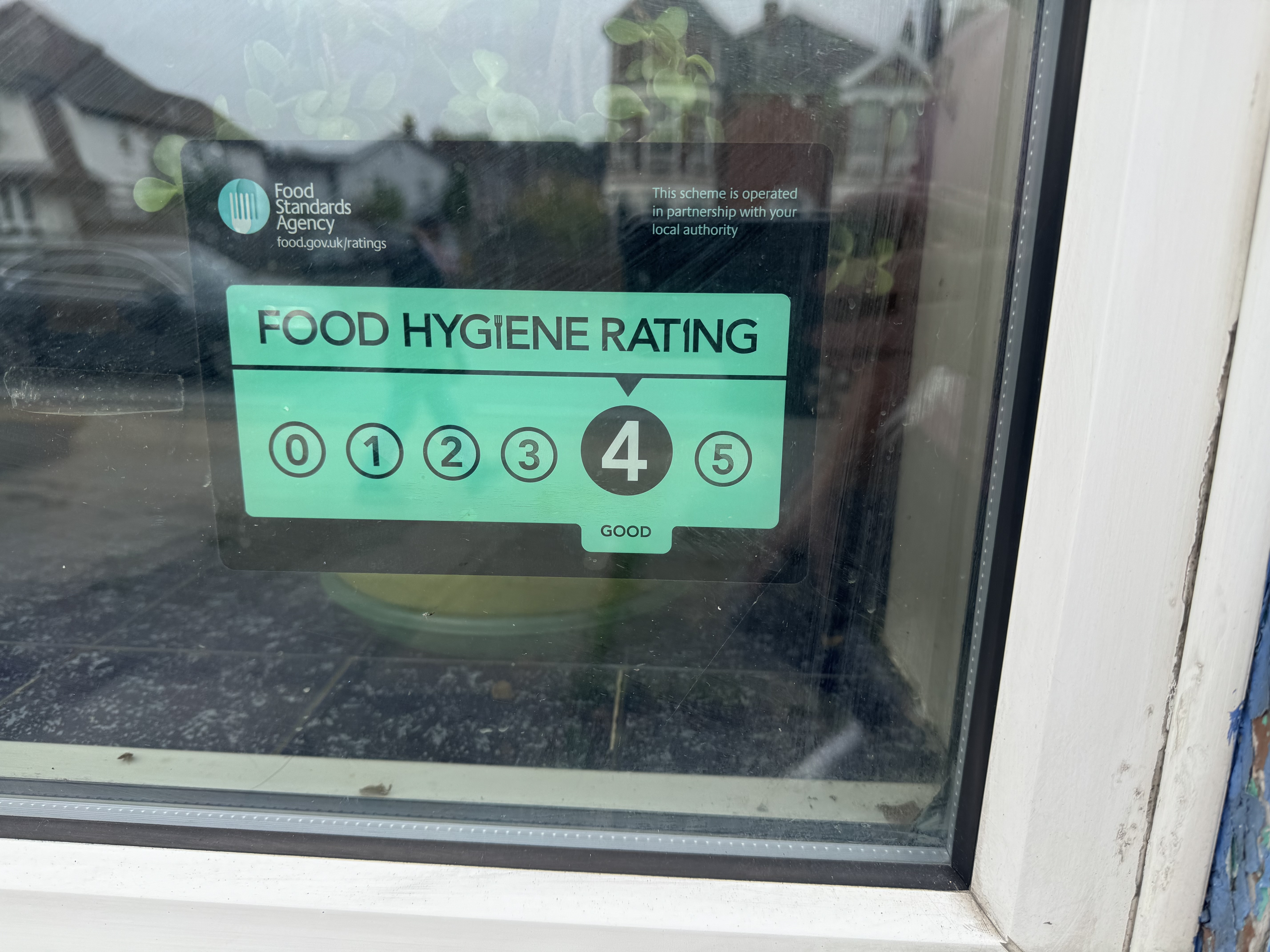 The Chop Suey House on Norwich Road, Ipswich displays a 4-star rating in its window despite receiving a 1-star rating 30 days ago