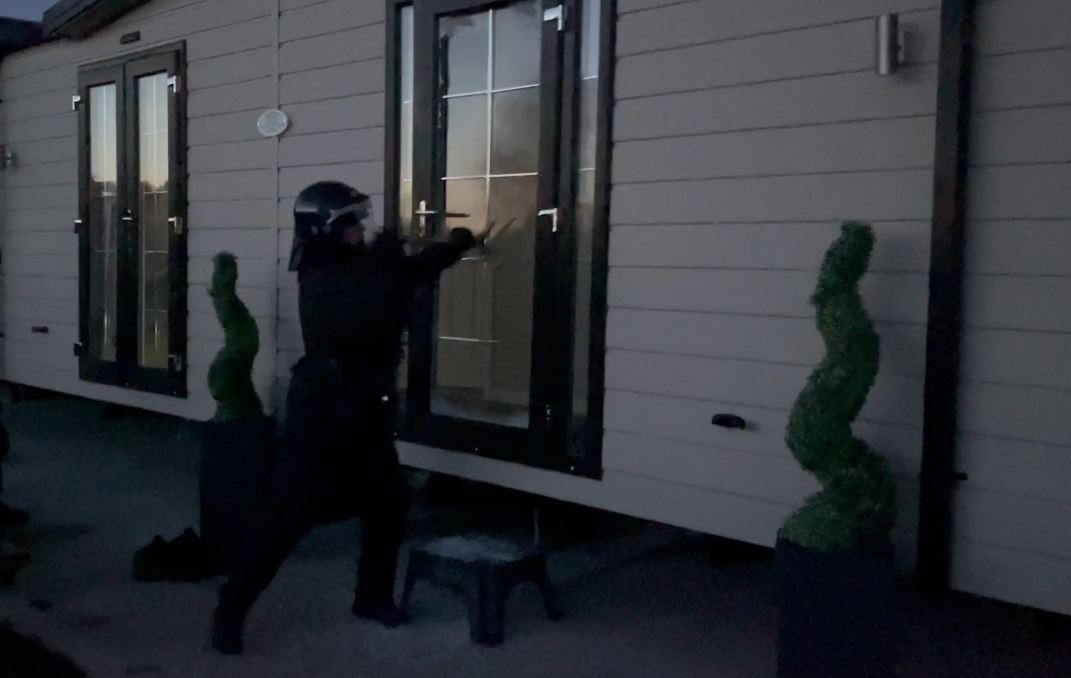 Police entering the property by force