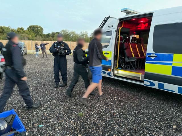 Suspects were loaded into a police van