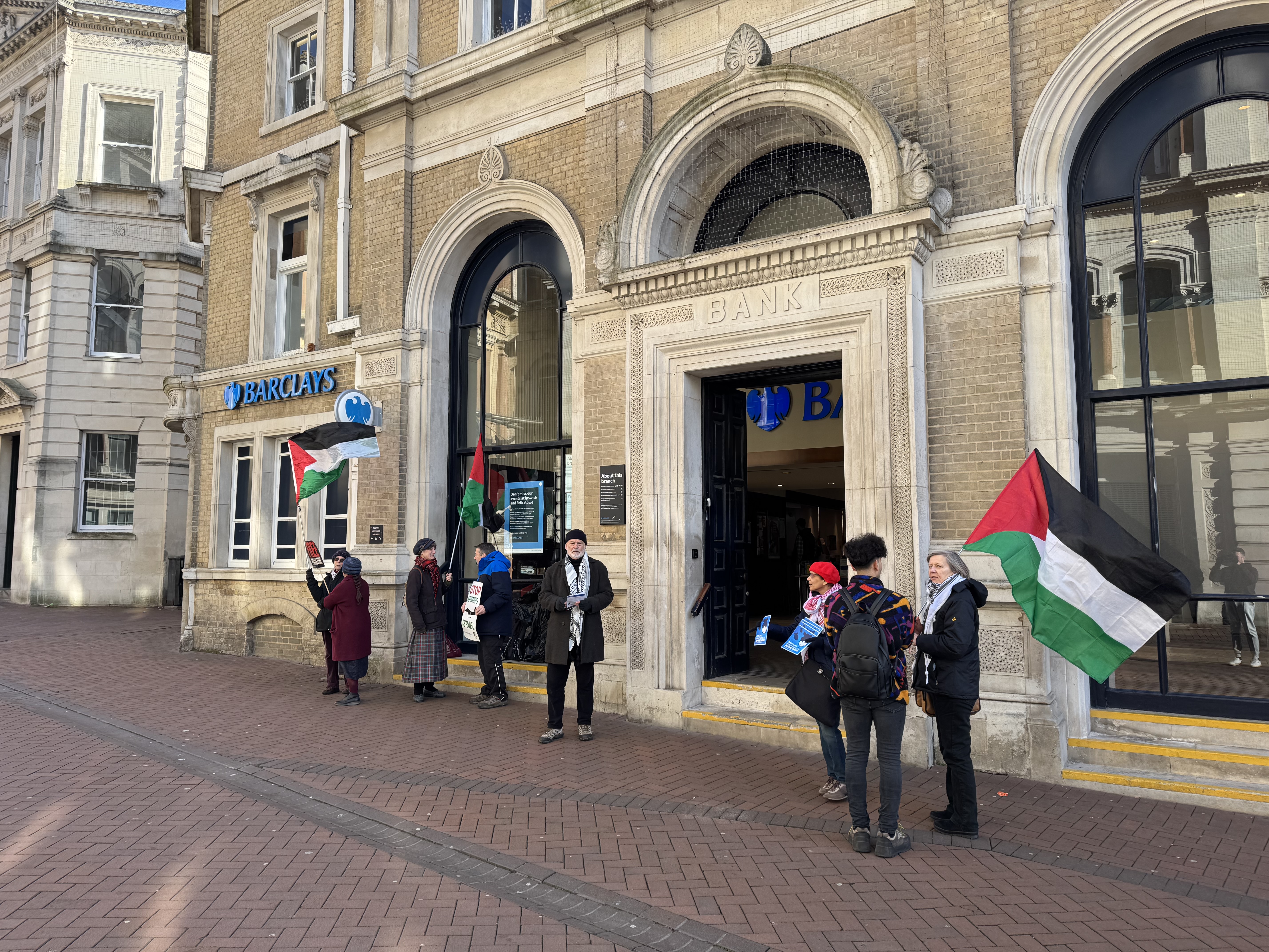 Eight demonstrators gathered outside Barclays Bank in Ipswich town centre today as part of a "Don't bank on apartheid" campaign