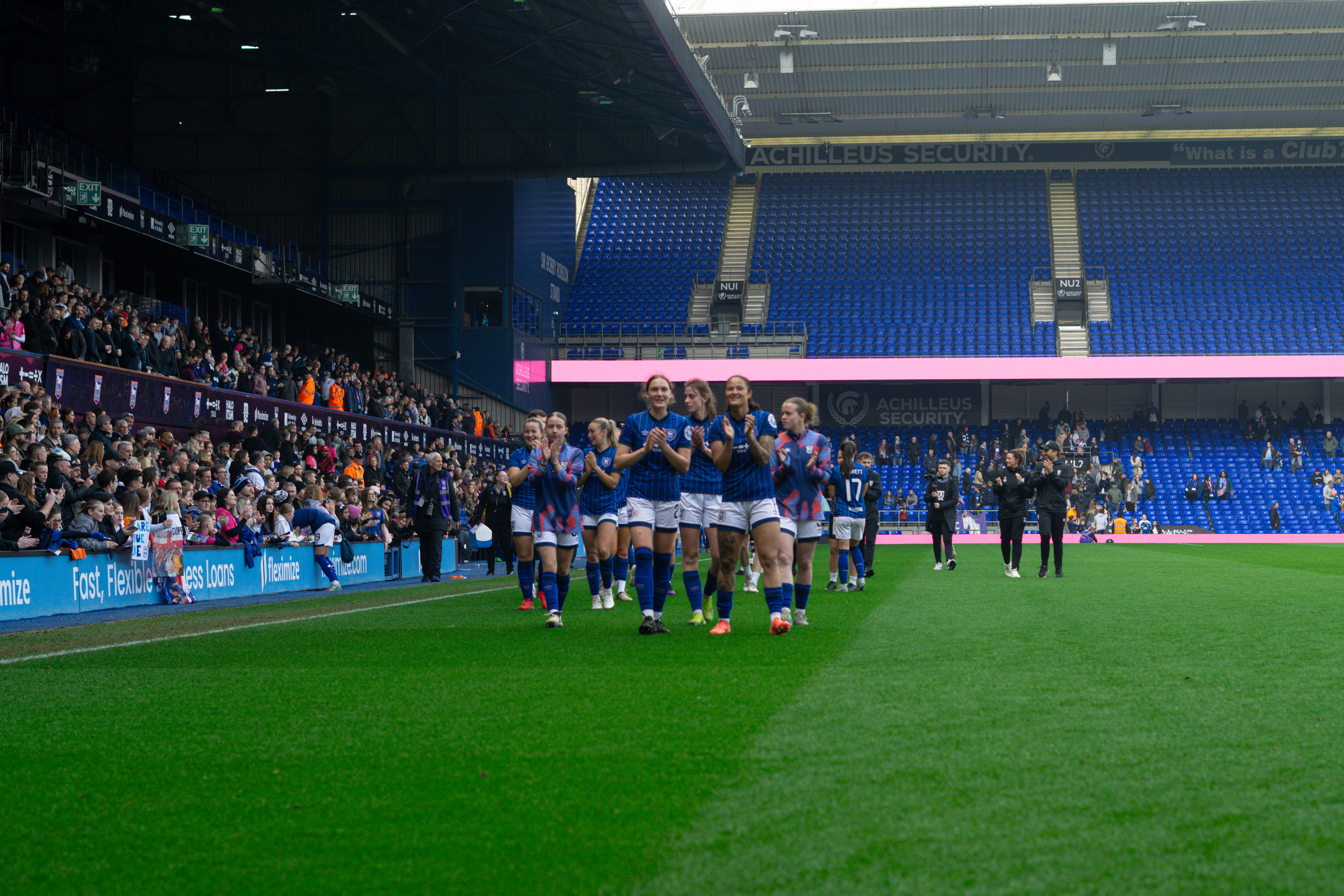 itfc women walking round the pitch clapping supporting fans