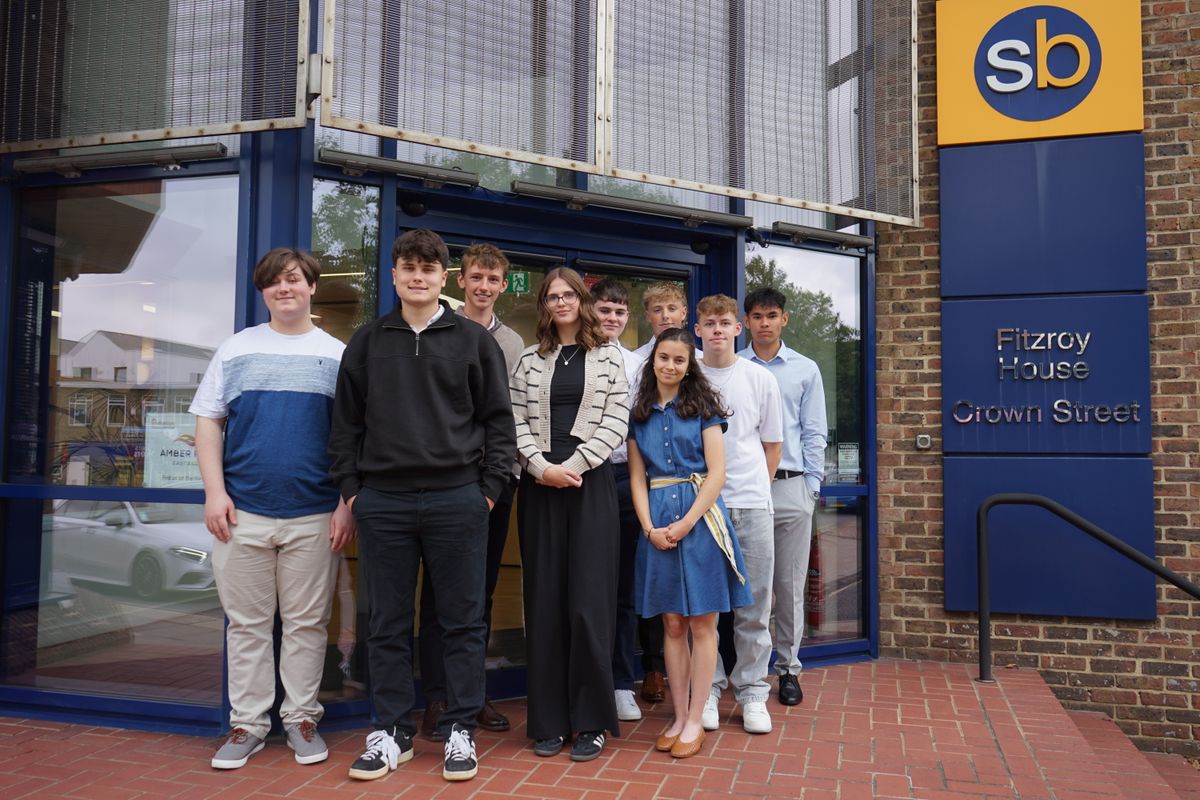 New trainees standing outside the Scrutton Bland office