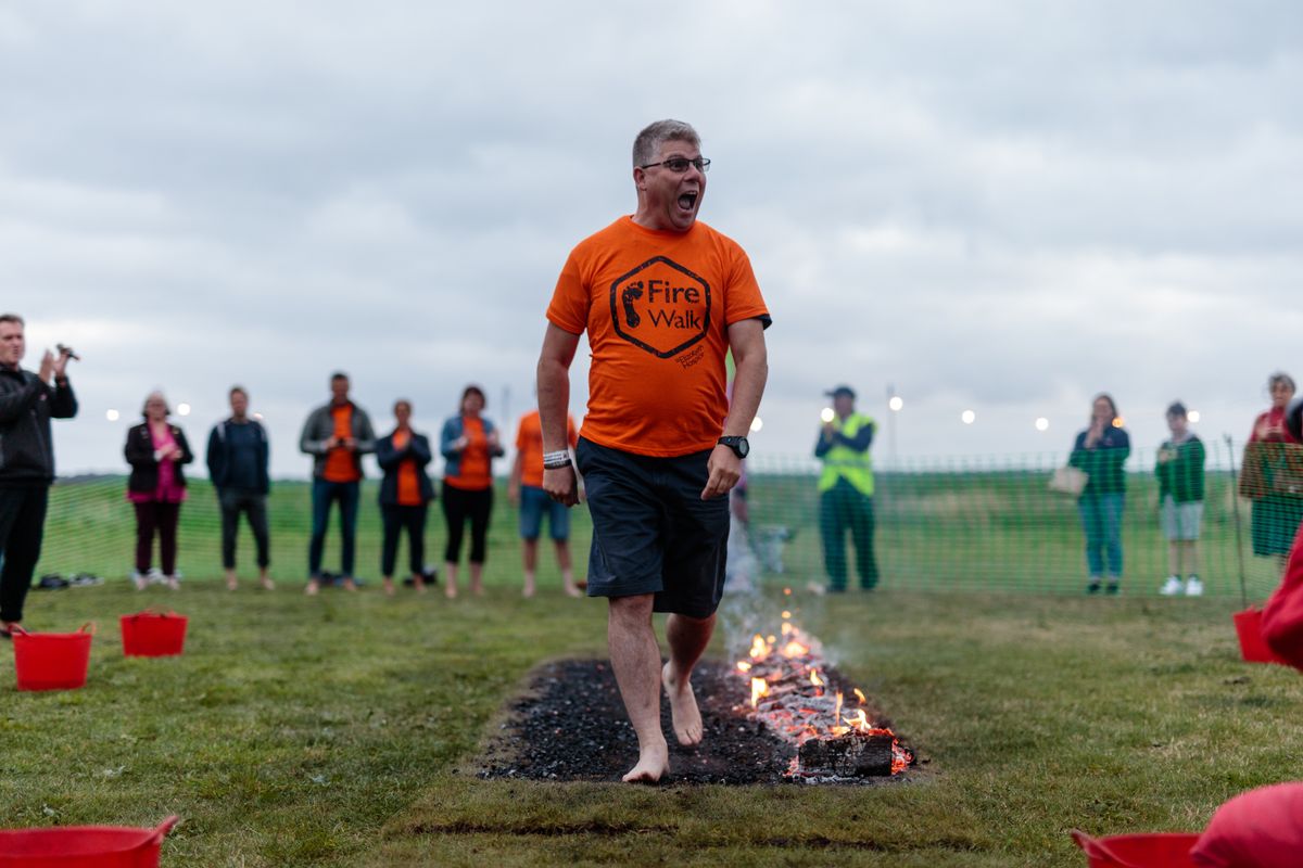 A man walking on hot embers