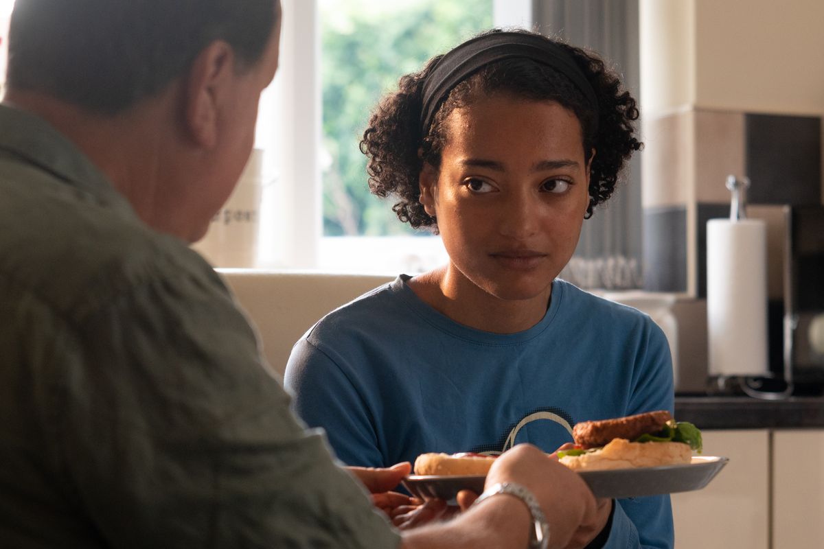 A black girl with her foster father