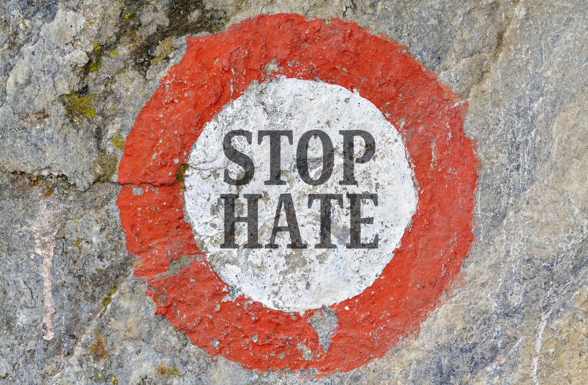 "Stop hate" written on a wall