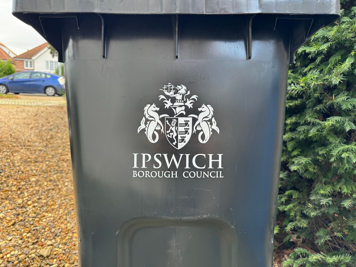A black bin with the Ipswich Borough Council logo