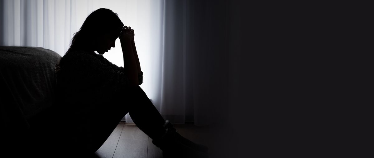 A depressed woman in her room