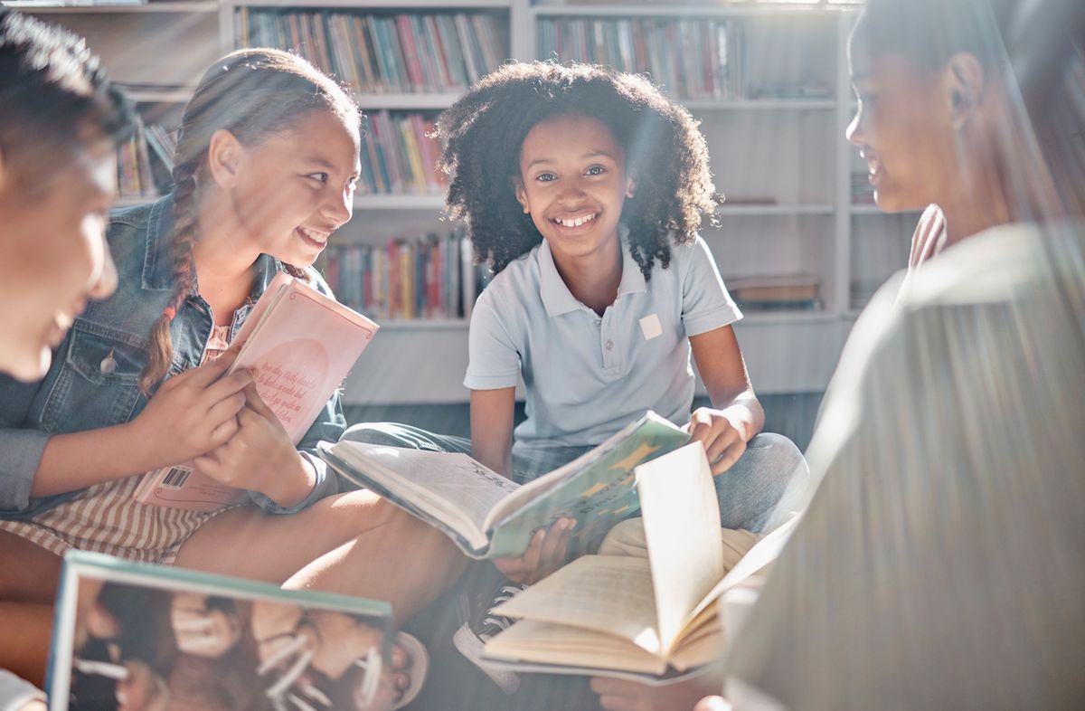 Primary school age children reading books