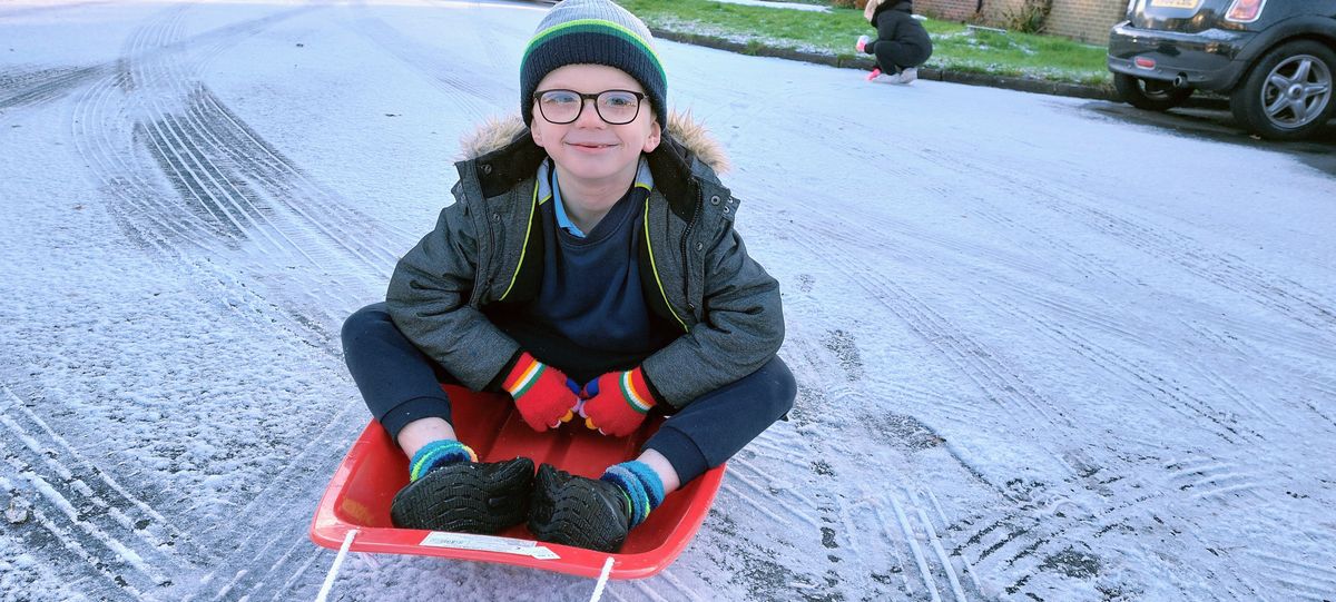 Harry Proctor made the most of the lightest of snowfalls as he took the sleigh to school in Capel St Mary