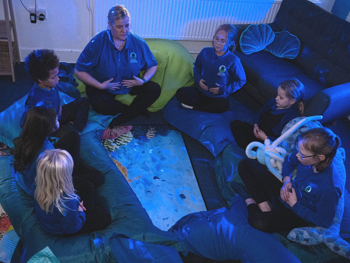 Kerry Snell teaching specialist breathing techniques to pupils aged 4 to 10