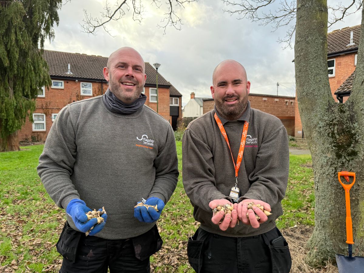 Newtide Homes neighbourhood officers Simon Ford and Jason Brett plant bulbs at a Flagship-owned green space off Bloomfield Street, Ipswich.