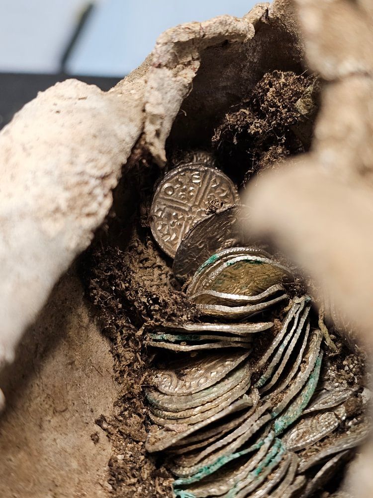 11th century silver coins wrapped in cloth and lead in a bundle