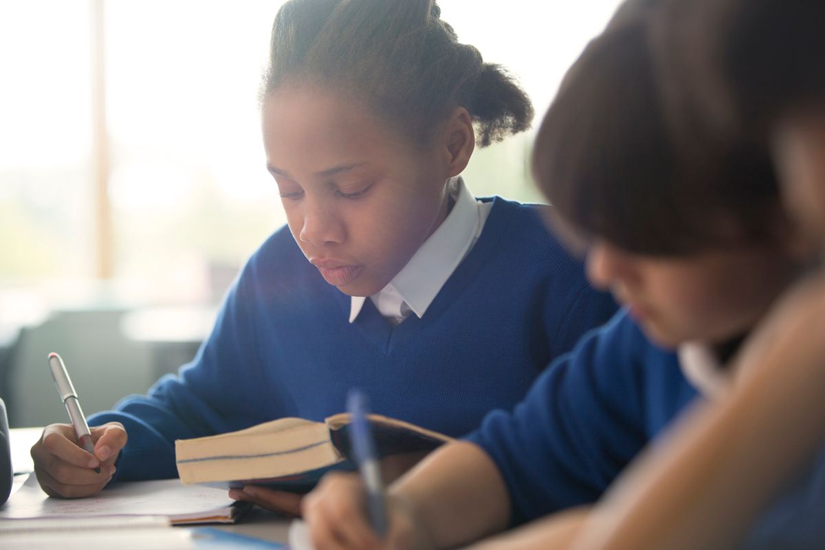 A young black female pupil at school
