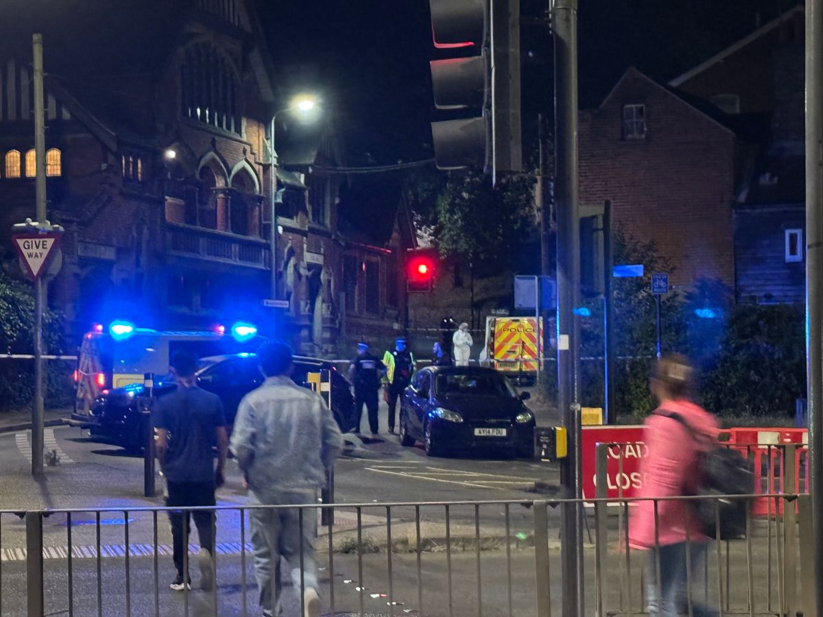 Police in forensic suits could be seen at the scene on Burrell Road