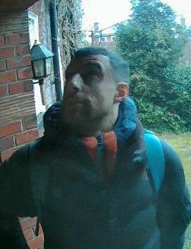 CCTV image of a man at someone's front door