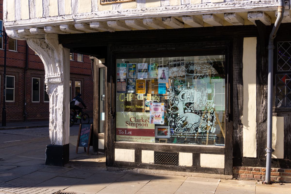 Building of where the chip is located with art at the front windows