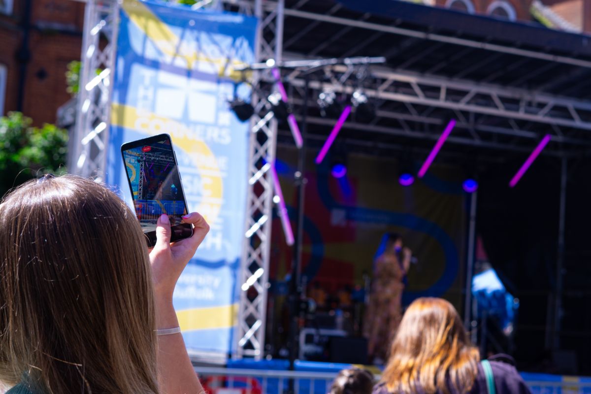 People filming the brighten the corners festival