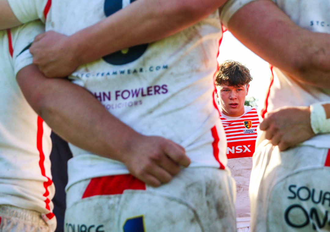 St Joseph's College rugby players huddle