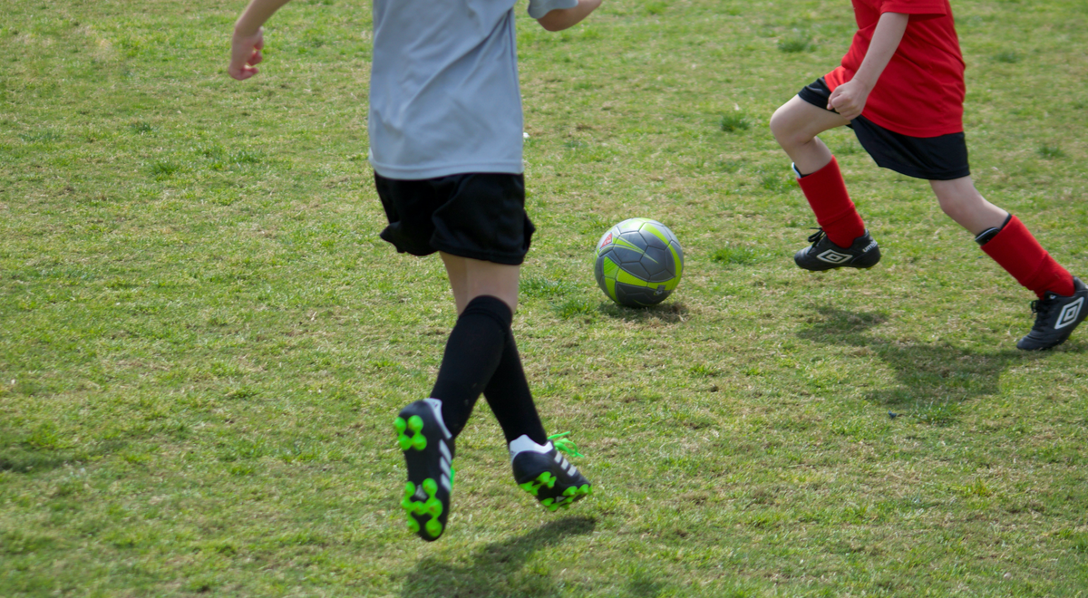 Kids playing football