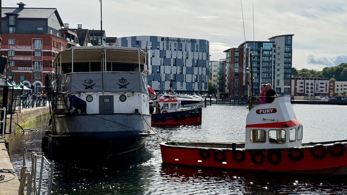 Onlookers watch as Mariners boat leaves Ipswich Waterfront