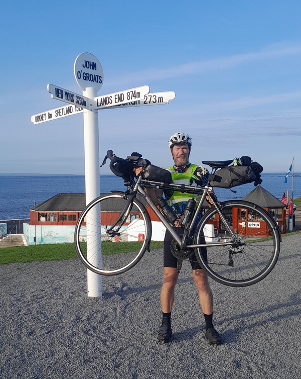 Mark Cornish at the end of his bike ride from Land's End to John o'Groats