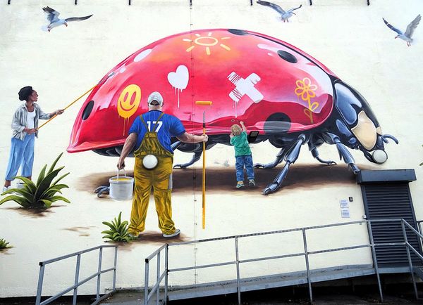 A large-scale mural on the Ashtons Legal building by Woskerski