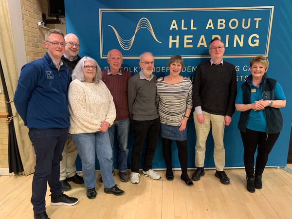 All About Hearing Directors, Matthew Coward and Karen Finch with quiz winners from April 2024