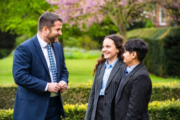 Mr Gregory with two pupils